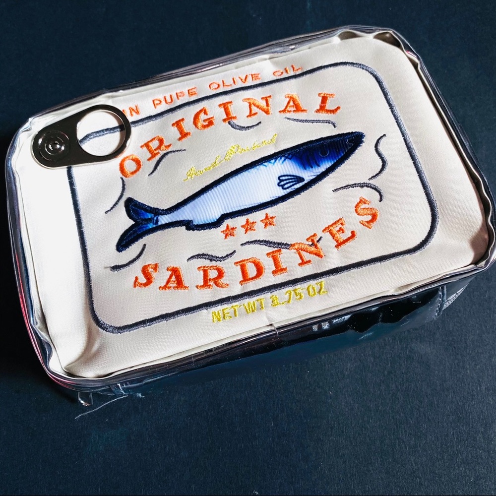 Campy and cute Sardine Can clutch cream & silver zip closure